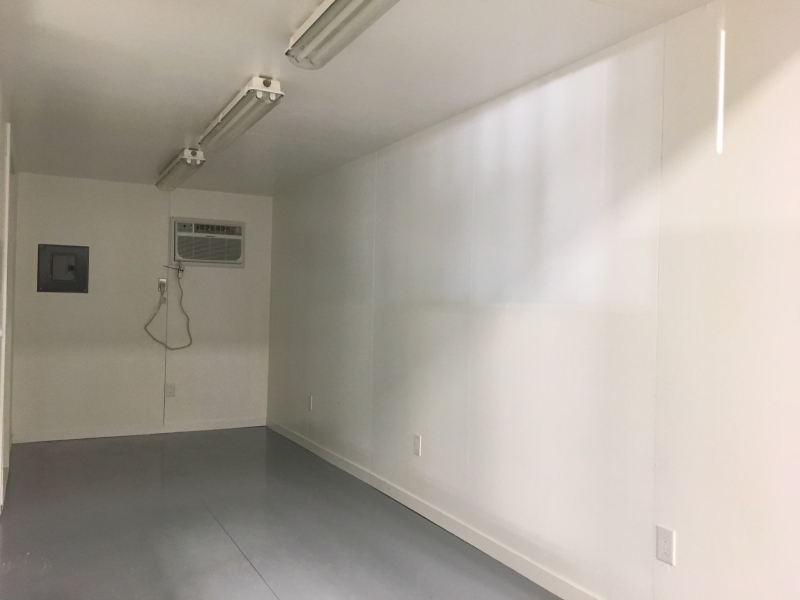 white interior of a c-can converted into an office at ace high storage